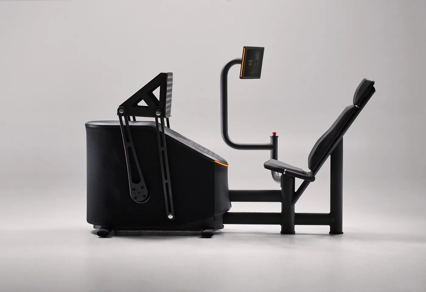 An EGYM Smart Strength machine in profile: black, with a small screen on an arm.